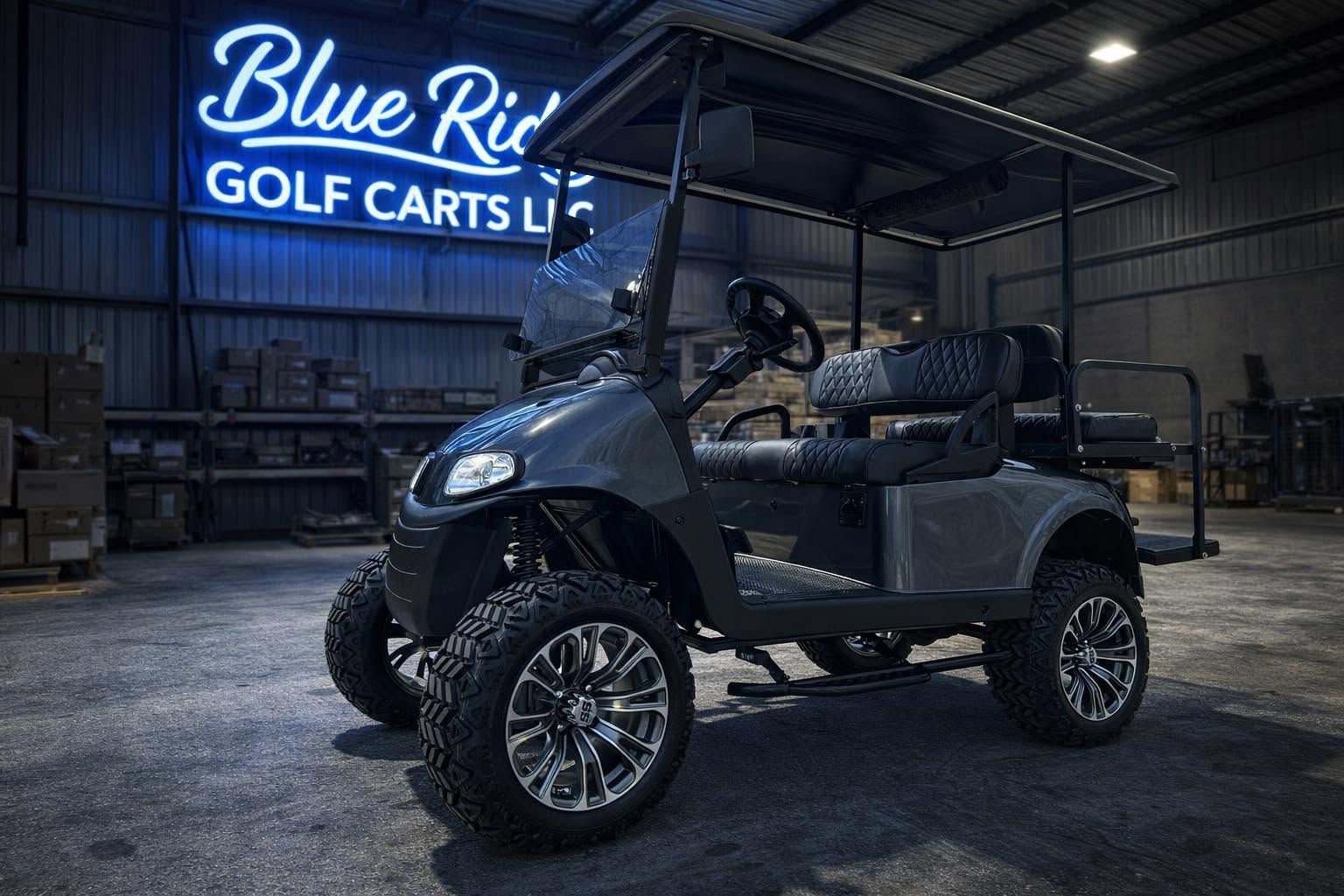 Lifted gunmetal EZGO RXV with black diamond-stitched seats in the Blue Ridge Golf Carts shop