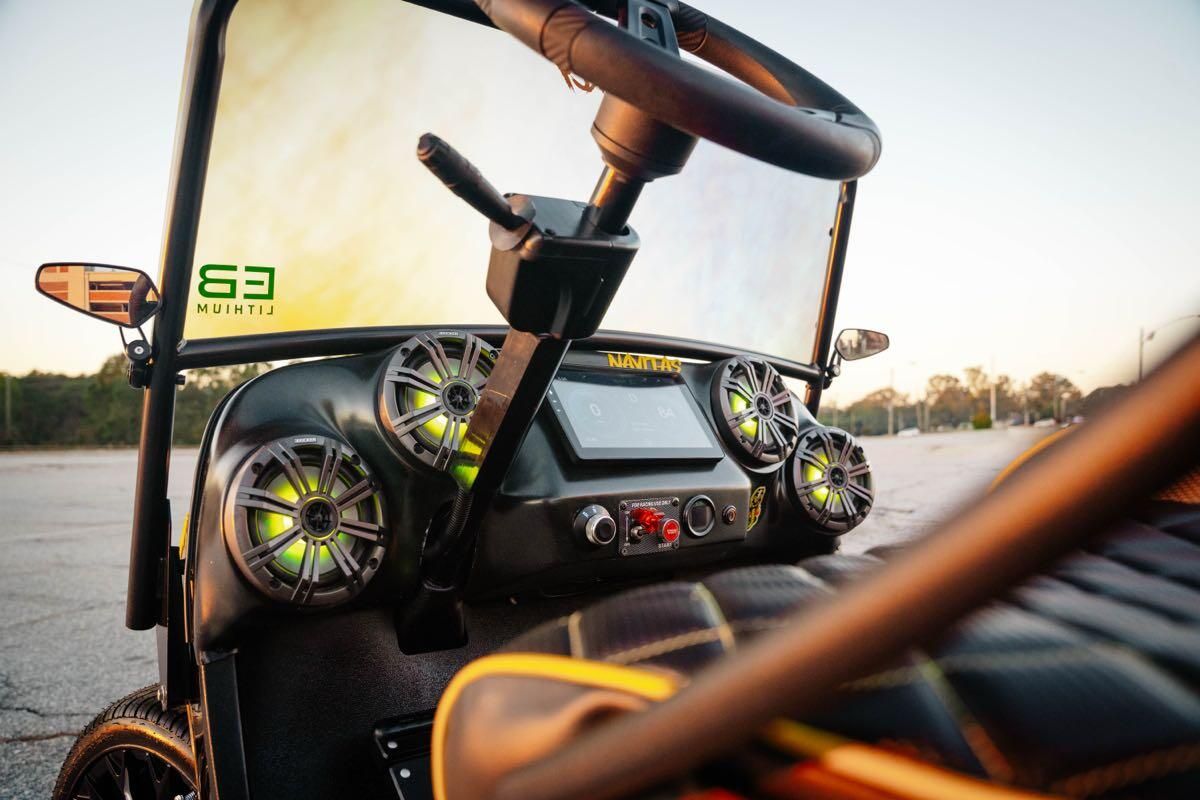 Carbon fiber dash with Navitas touchscreen and four Kicker speakers